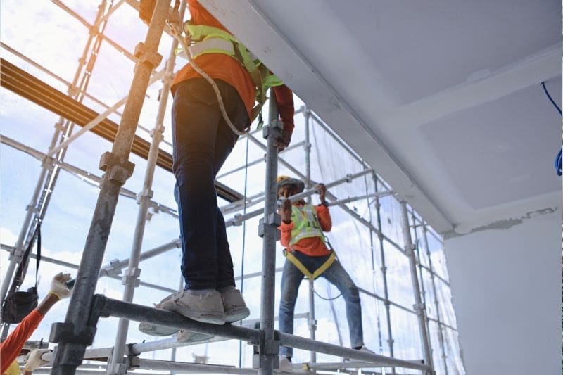image about two workers scaffolding