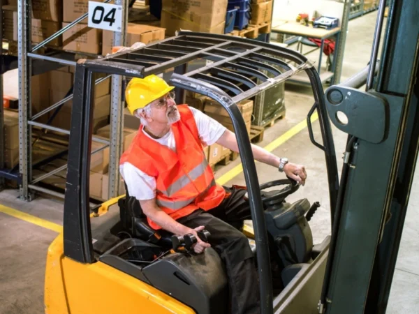 Warehouse employment agency workers picking orders and operating forklifts in a busy warehouseWarehouse employment agency workers picking orders and operating forklifts in a busy warehouse